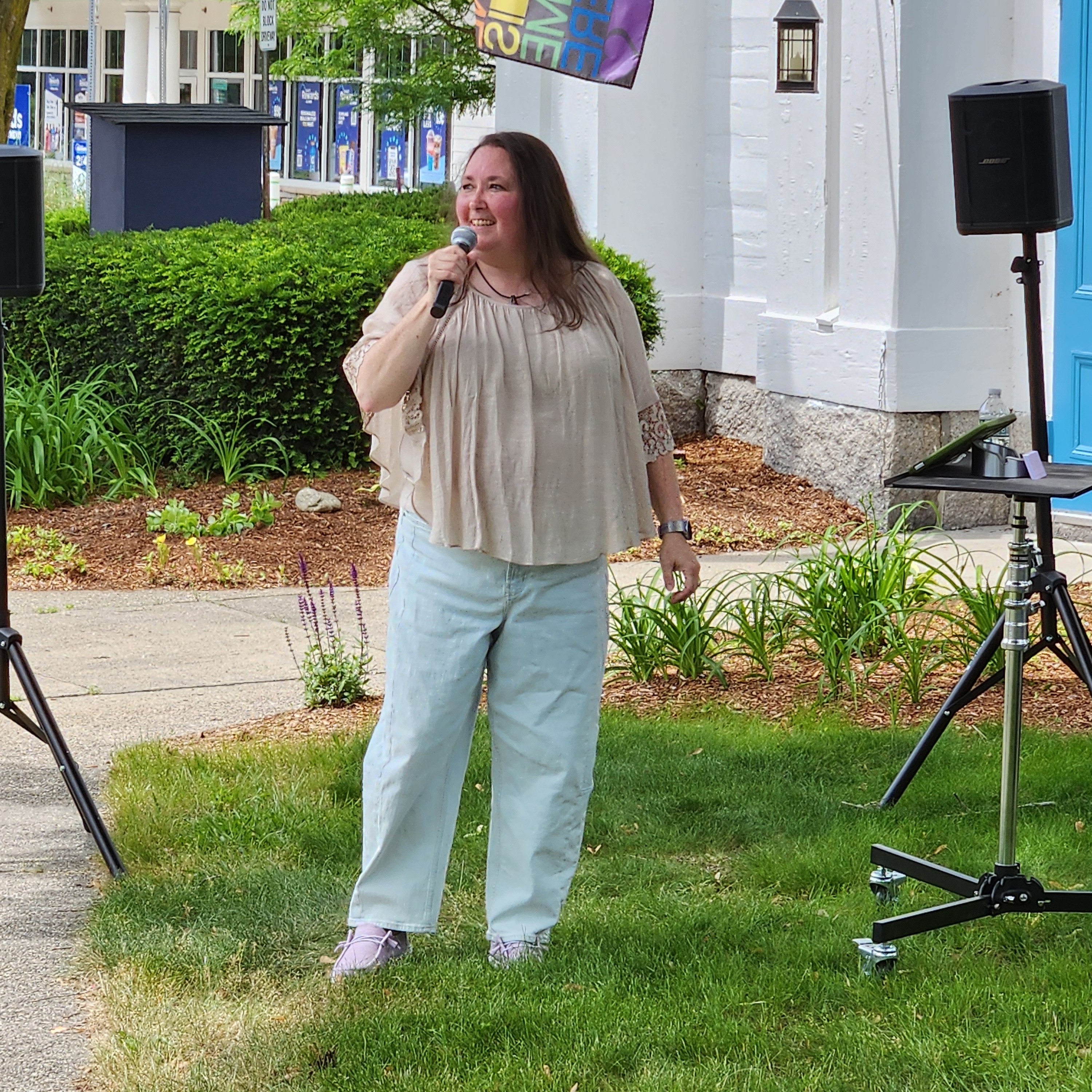An image of Esther Rhatigan singing in front Trinity Church as part of the Northborough Porchfest. Photo credit: Jeanne Woods
